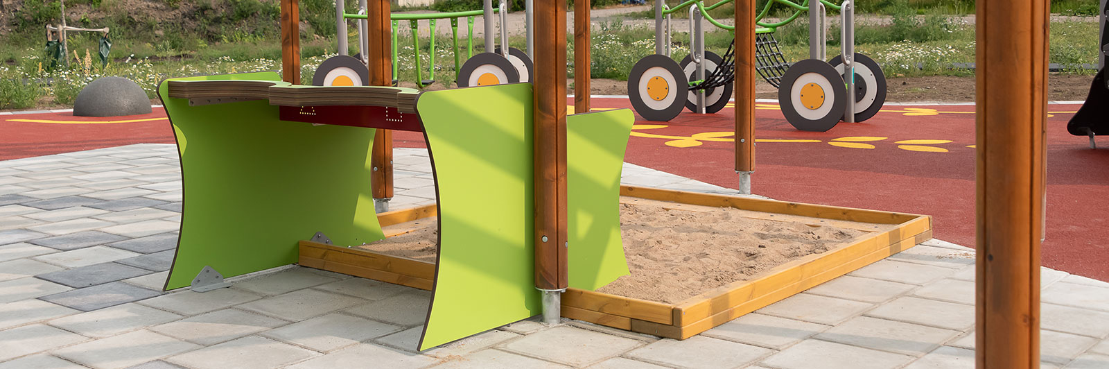 A sandbox with sand and an elevated sand table for playtime and playground.